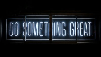 Neon sign that says Do Something Great