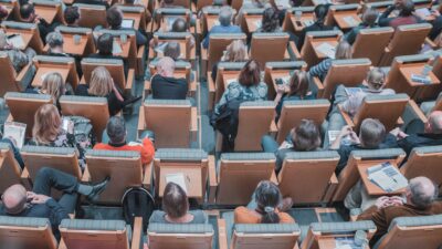 image of community coalition meeting group seated in auditorium from overhead