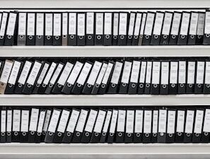 shelf full of data in binders