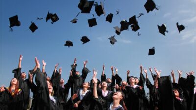image of students throwing graduation caps student academic success