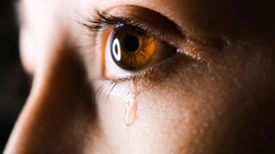 woman with tear falling down her face domestic violence